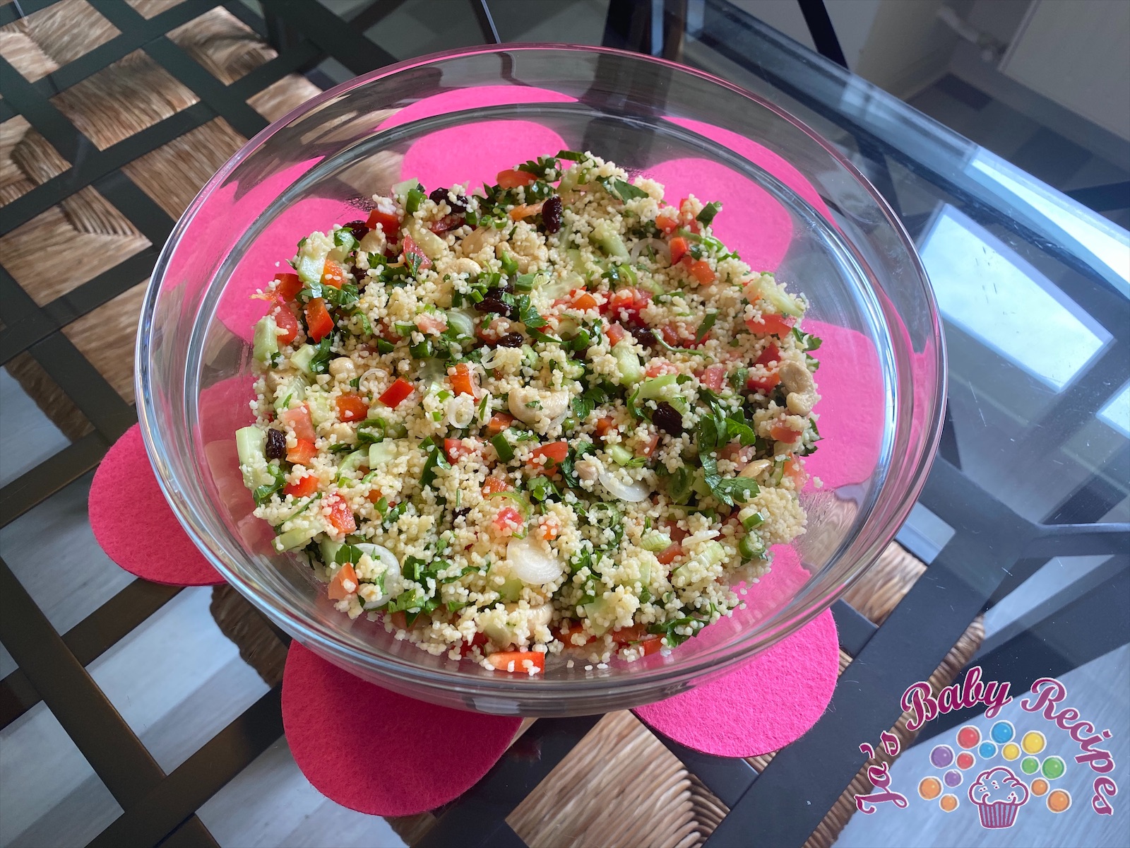 Baby friendly couscous with vegetables, raisins and cashew