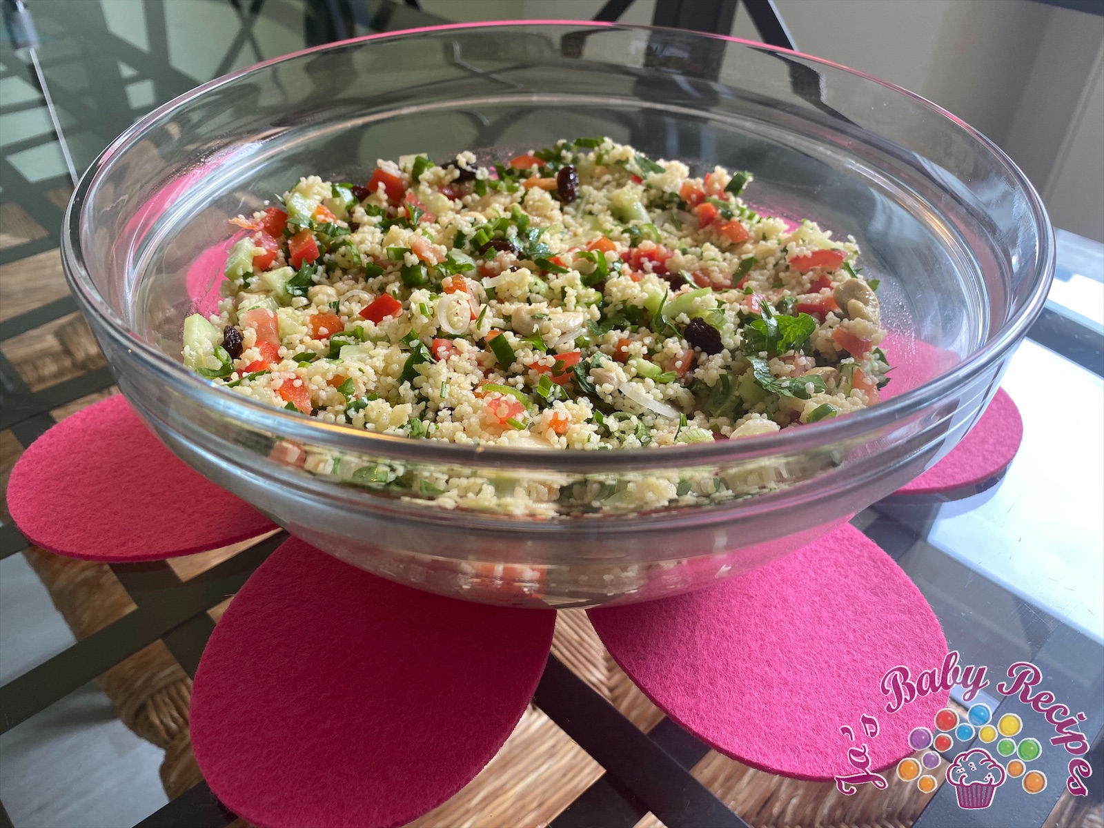 Baby friendly couscous with vegetables, raisins and cashew