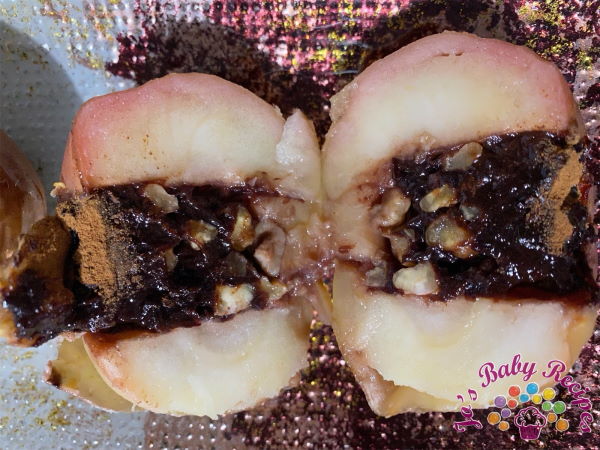 Baked apples stuffed with nuts and plum jam for babies