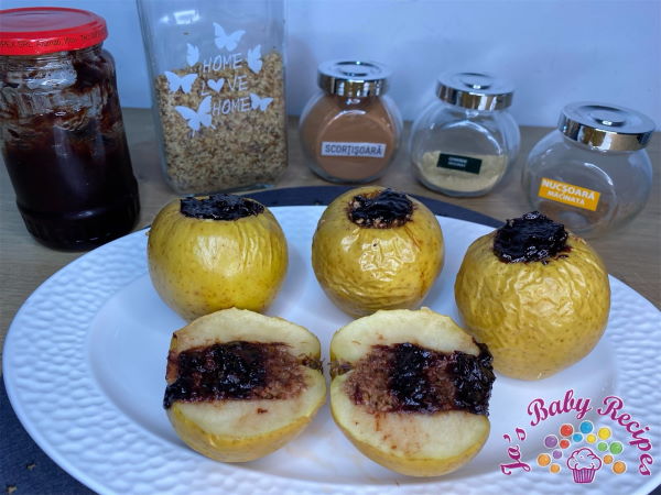 Baked apples stuffed with plum jam and winter spices for babies