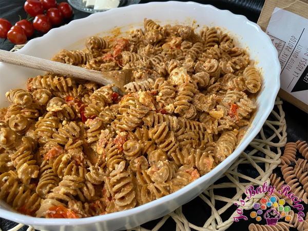 Pasta with tomatoes and baked cheese for babies