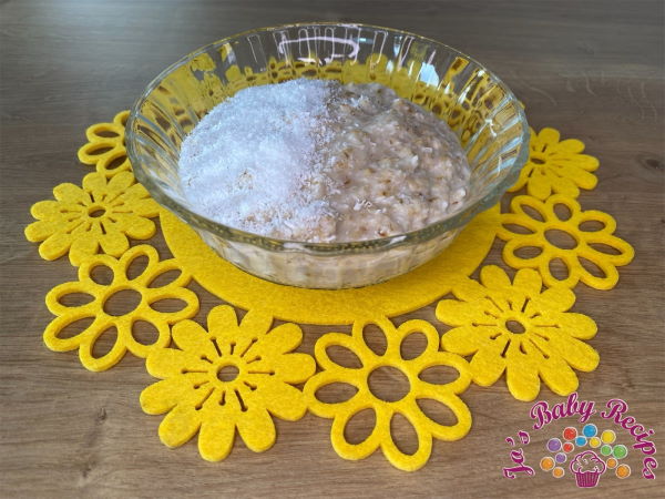 Porridge of oatmeal with coconut flakes for babies